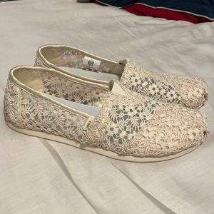 Like new TOMS ivory lace slip ons